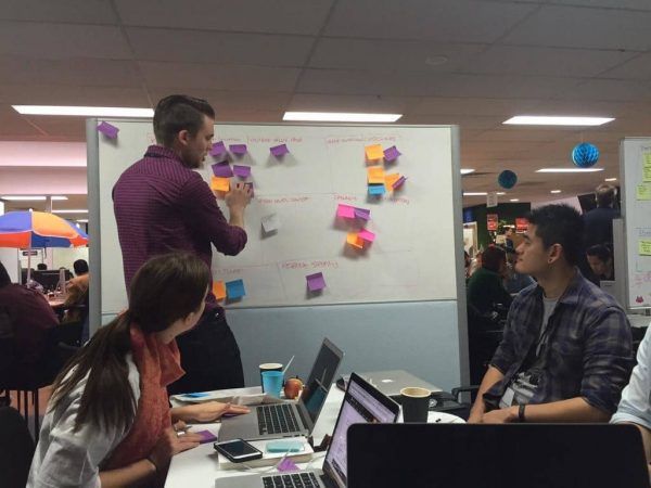 Patrick, Brylie and Tyler making plans for Soul Travel on the whiteboard