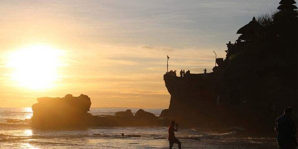 The sun setting over Tanah Lot